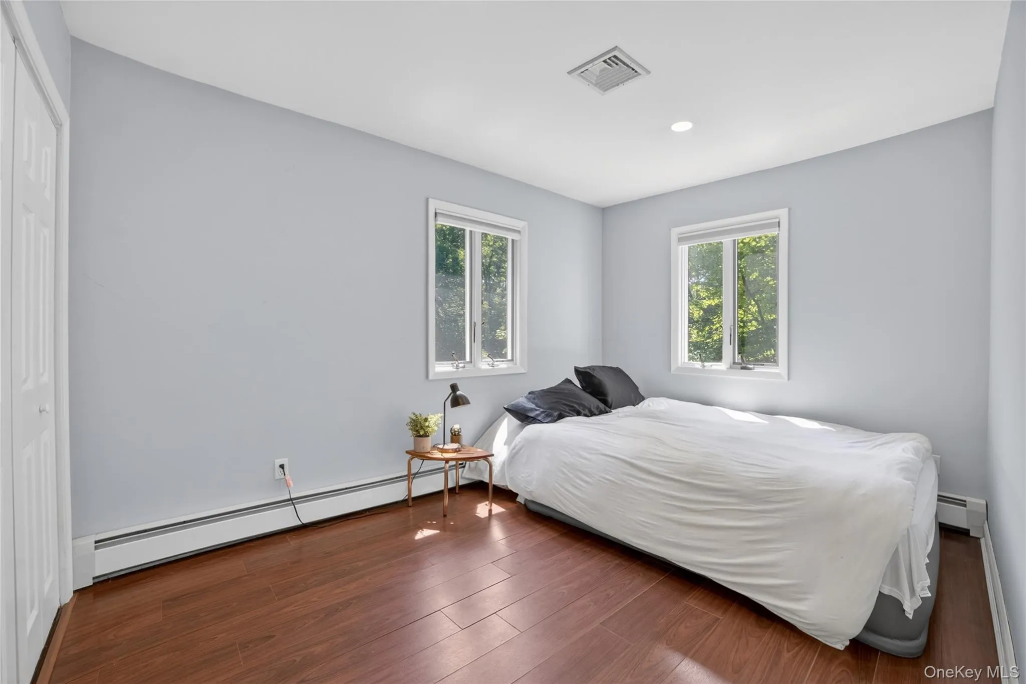 The second bedroom on the first floor hardwood floors and two corner windows for so much natural light. The second bedroom on the first floor hardwood floors and two corner windows for so much natural light.