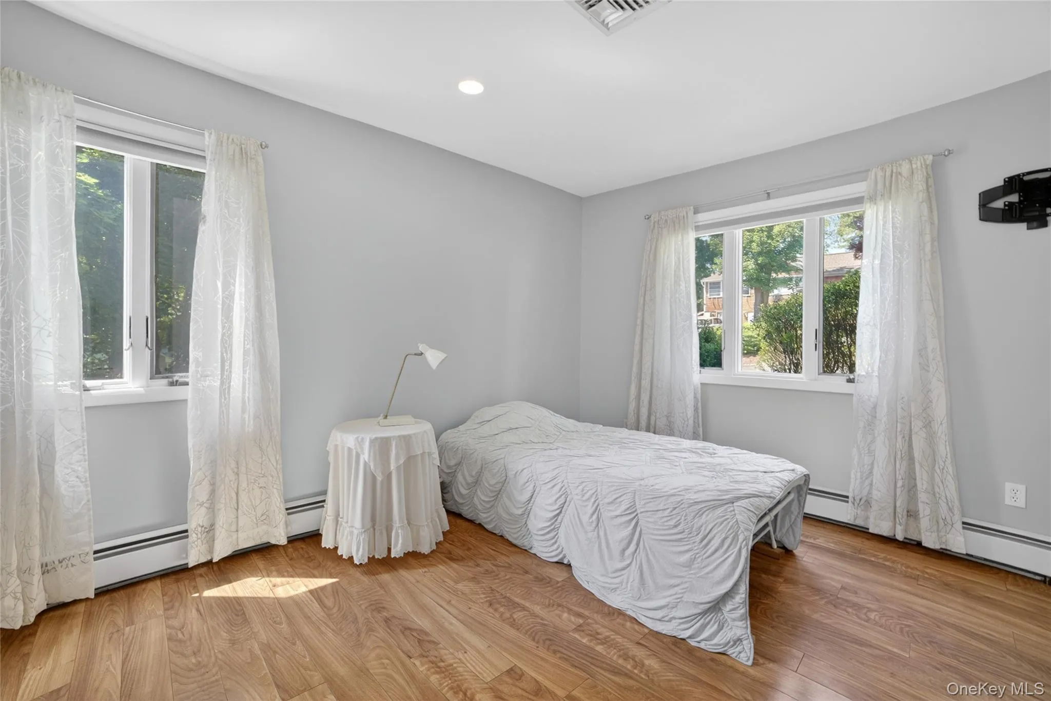One of two First floor bedrooms with hardwood floors and cross ventilation. One of two First floor bedrooms with hardwood floors and cross ventilation.