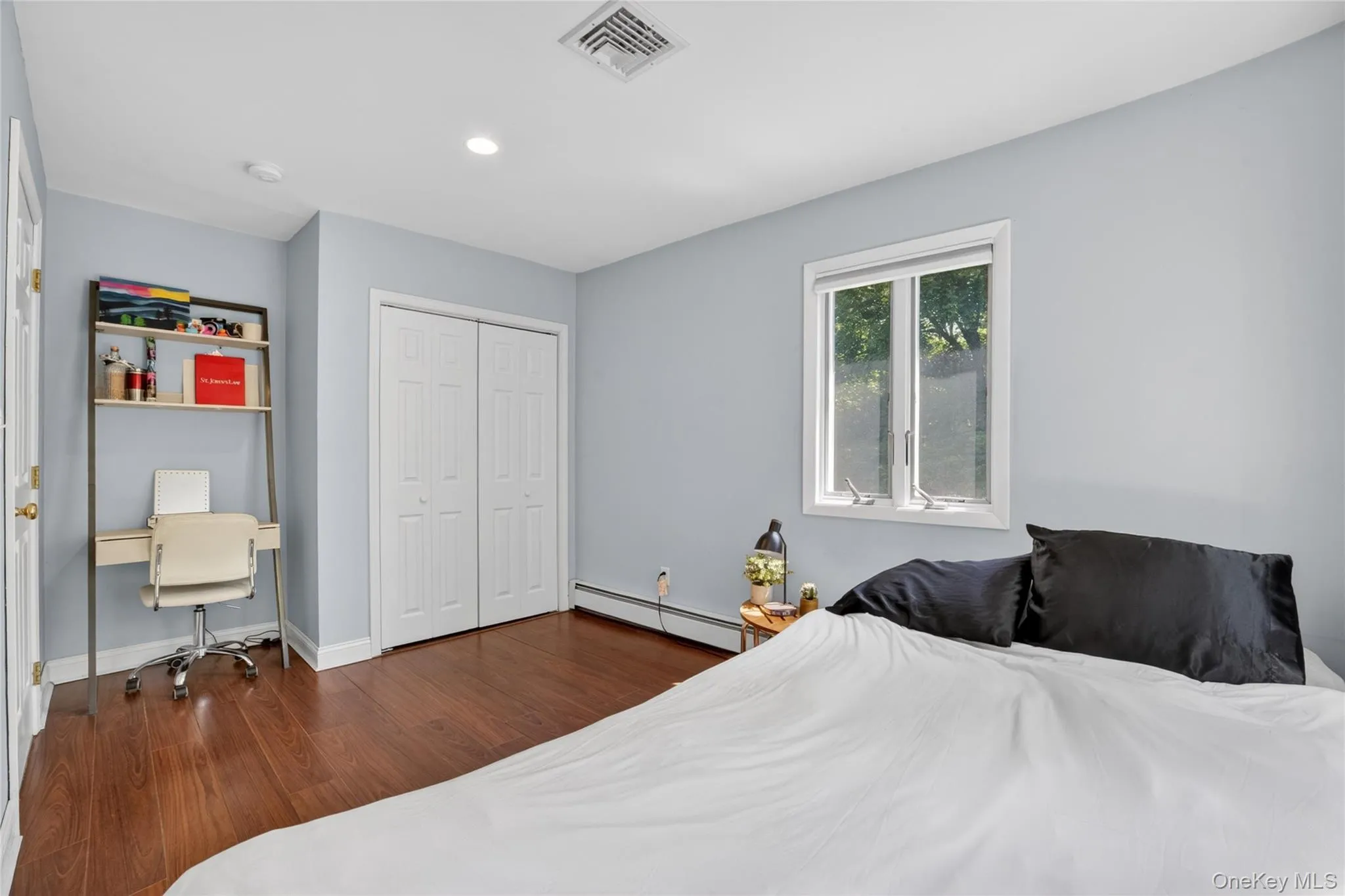 The second first floor bedroom includes an alcove for a desk, vanity or storage space. The second first floor bedroom includes an alcove for a desk, vanity or storage space.