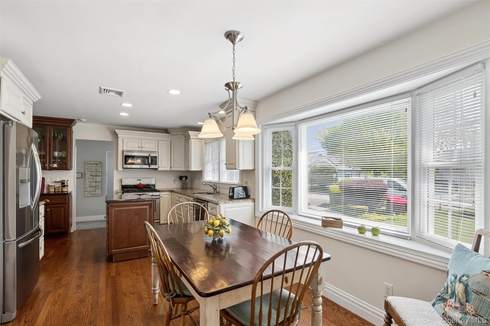 Gracious Eat-in-kitchen with sunny eating area. The Center Island has loads of storage and there is a coffee bar. The countertops are quartz and the additional cabinets have pullout drawers for ample storage. The laundry room is right off the kitchen as well as access to the 2 car garage. Gracious Eat-in-kitchen with sunny eating area. The Center Island has loads of storage and there is a coffee bar. The countertops are quartz and the additional cabinets have pullout drawers for ample storage. The laundry room is right off the kitchen as well as access to the 2 car garage.