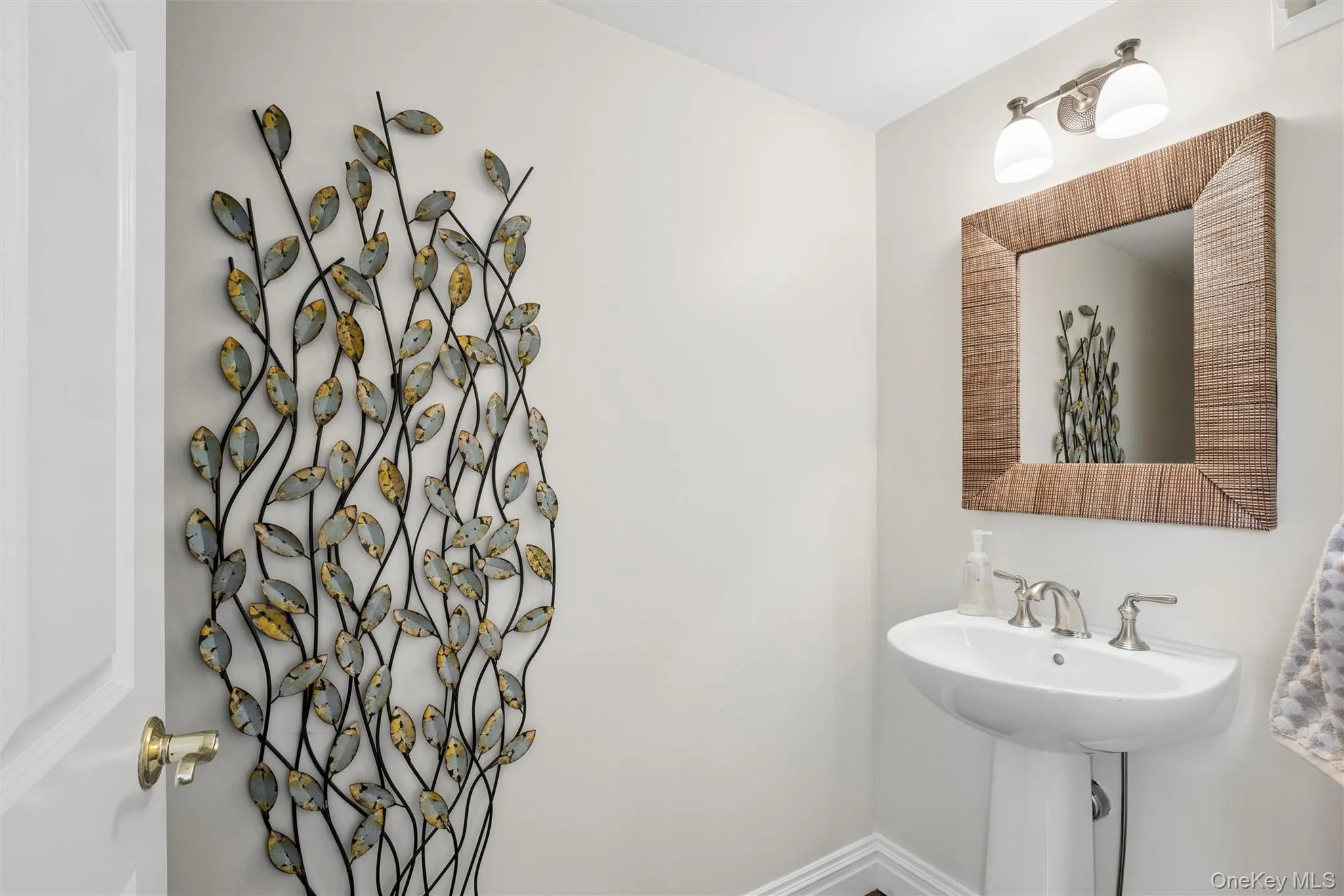 Convenient 1/2 bath is right off the sunroom. Convenient 1/2 bath is right off the sunroom.