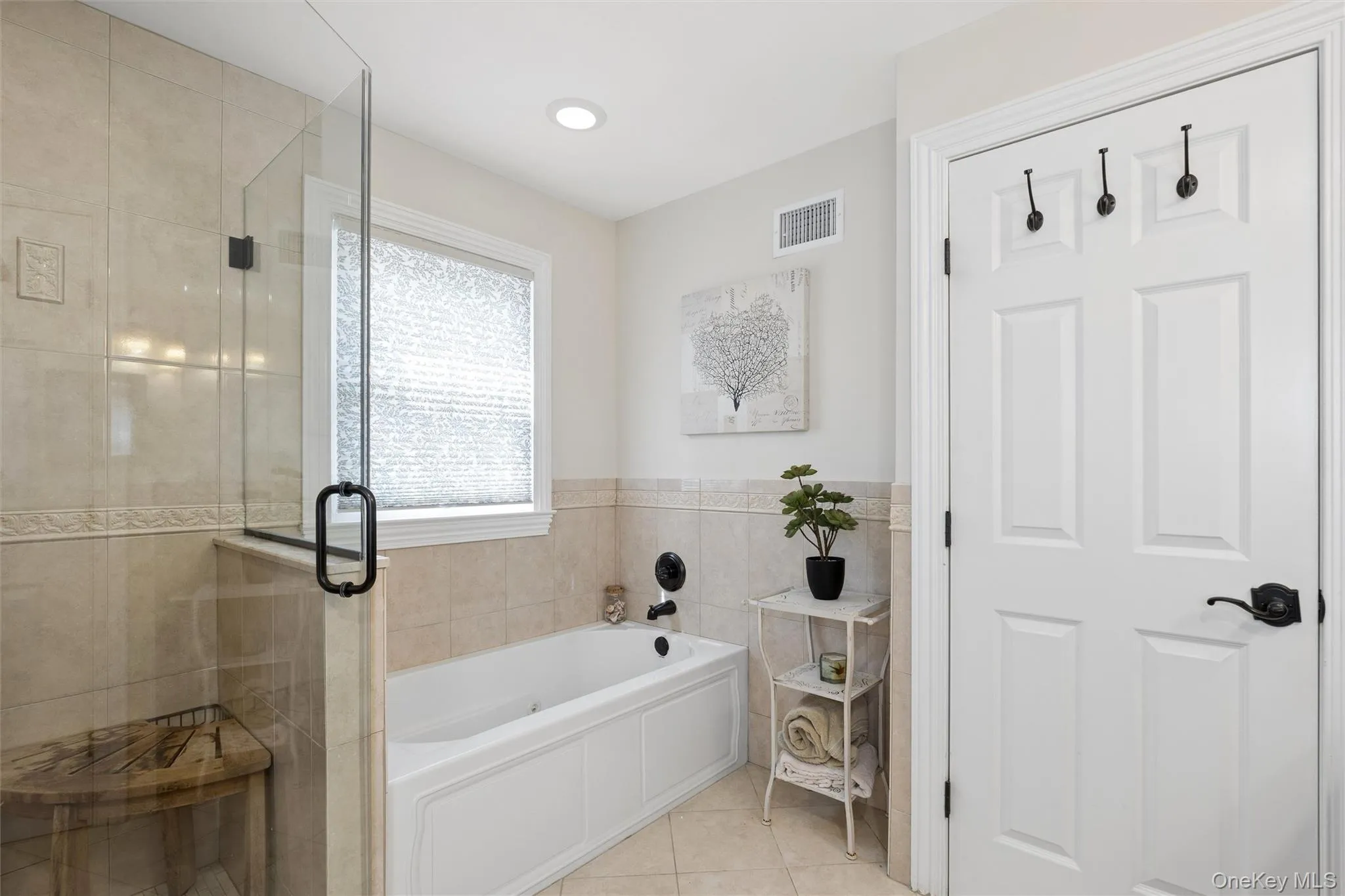 There's a separate shower as well as a jacuzzi tub for the perfect spa experience.. There's a separate shower as well as a jacuzzi tub for the perfect spa experience..