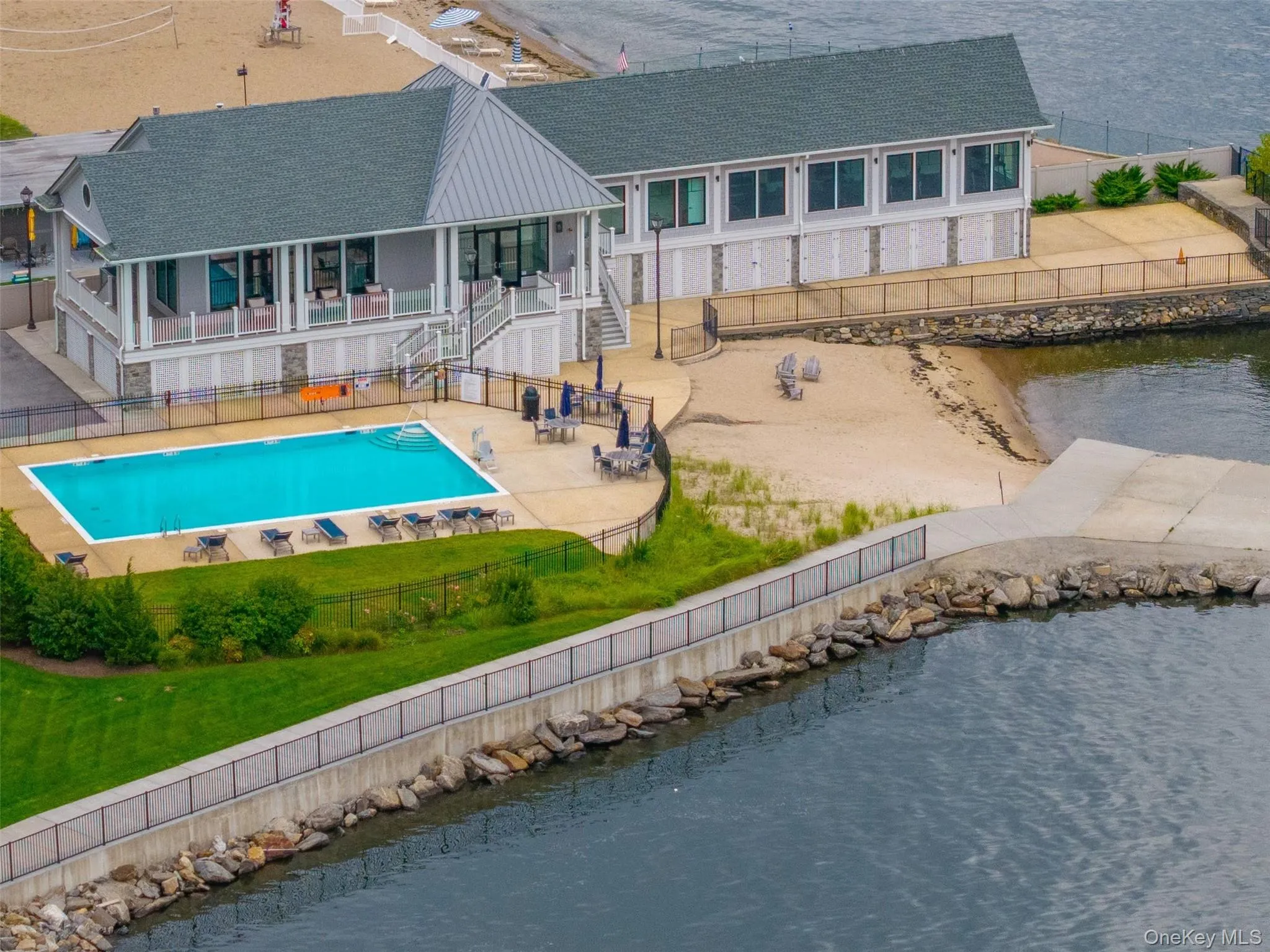 Community pool, beach and clubhouse Community pool, beach and clubhouse