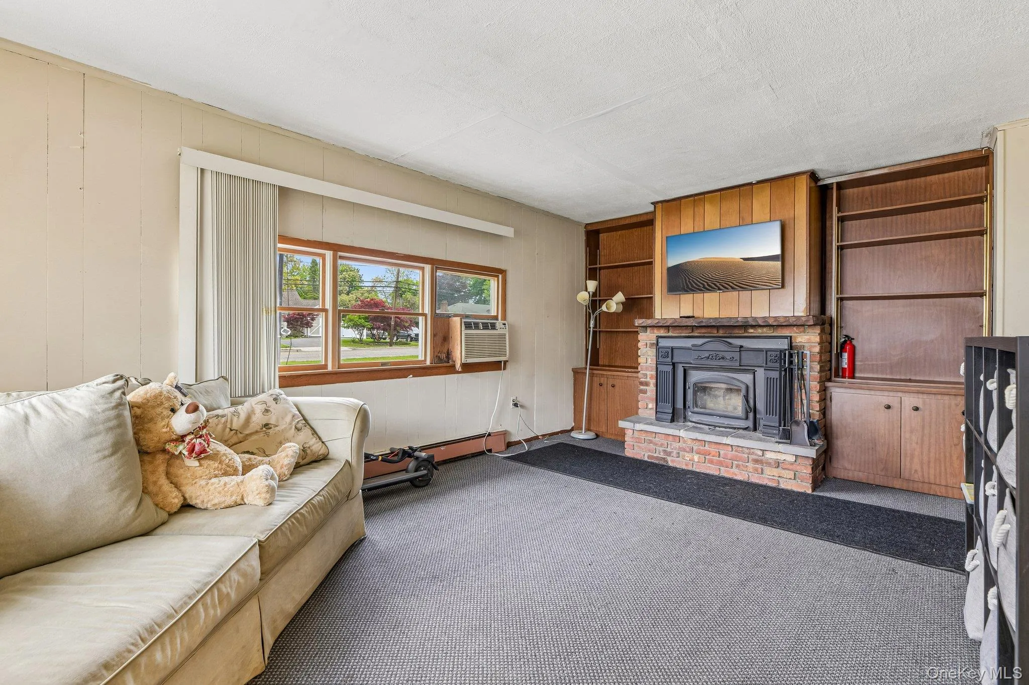 Den/Family Room with Woodburning Fireplace Den/Family Room with Woodburning Fireplace