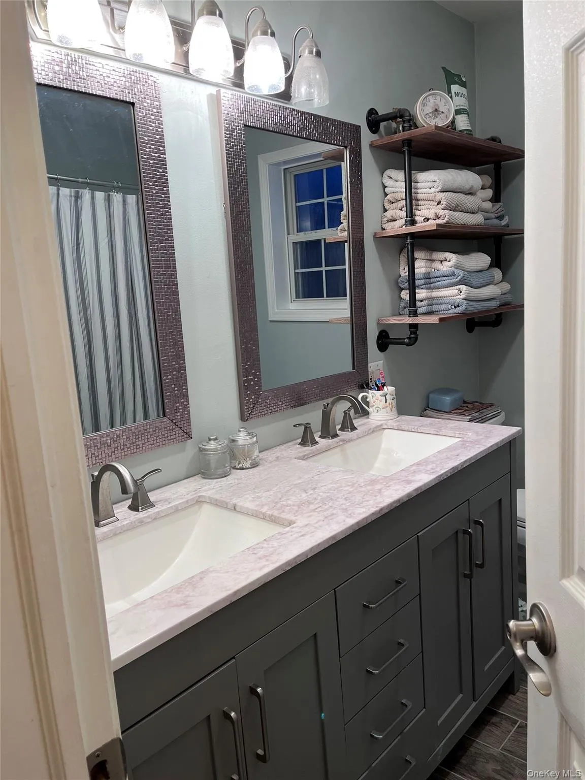 Primary Bathroom with double sinks and linen closet. Primary Bathroom with double sinks and linen closet.