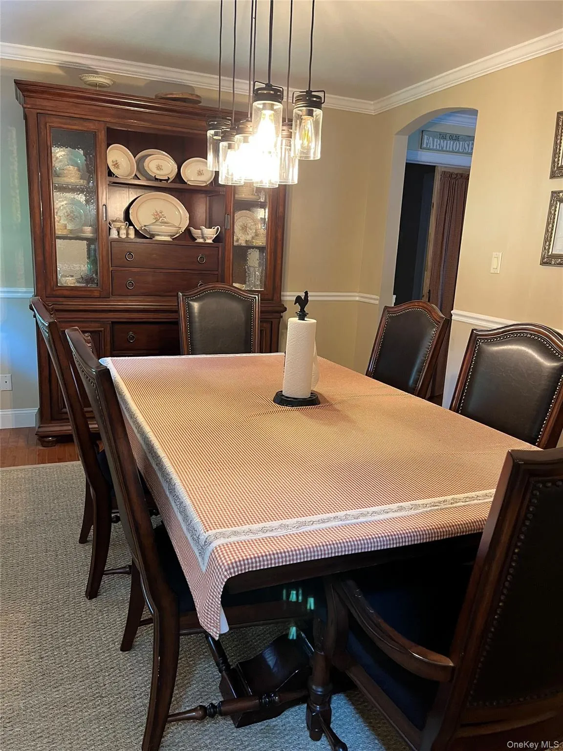Dining room featuring a contemporary multi-light pendant fixture. Dining room featuring a contemporary multi-light pendant fixture.