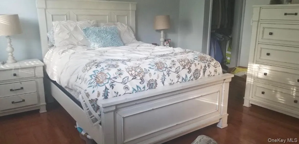 Hardwood flooring provides a warm finish to your primary suite. Walk in closet and extra closet space. Hardwood flooring provides a warm finish to your primary suite. Walk in closet and extra closet space.