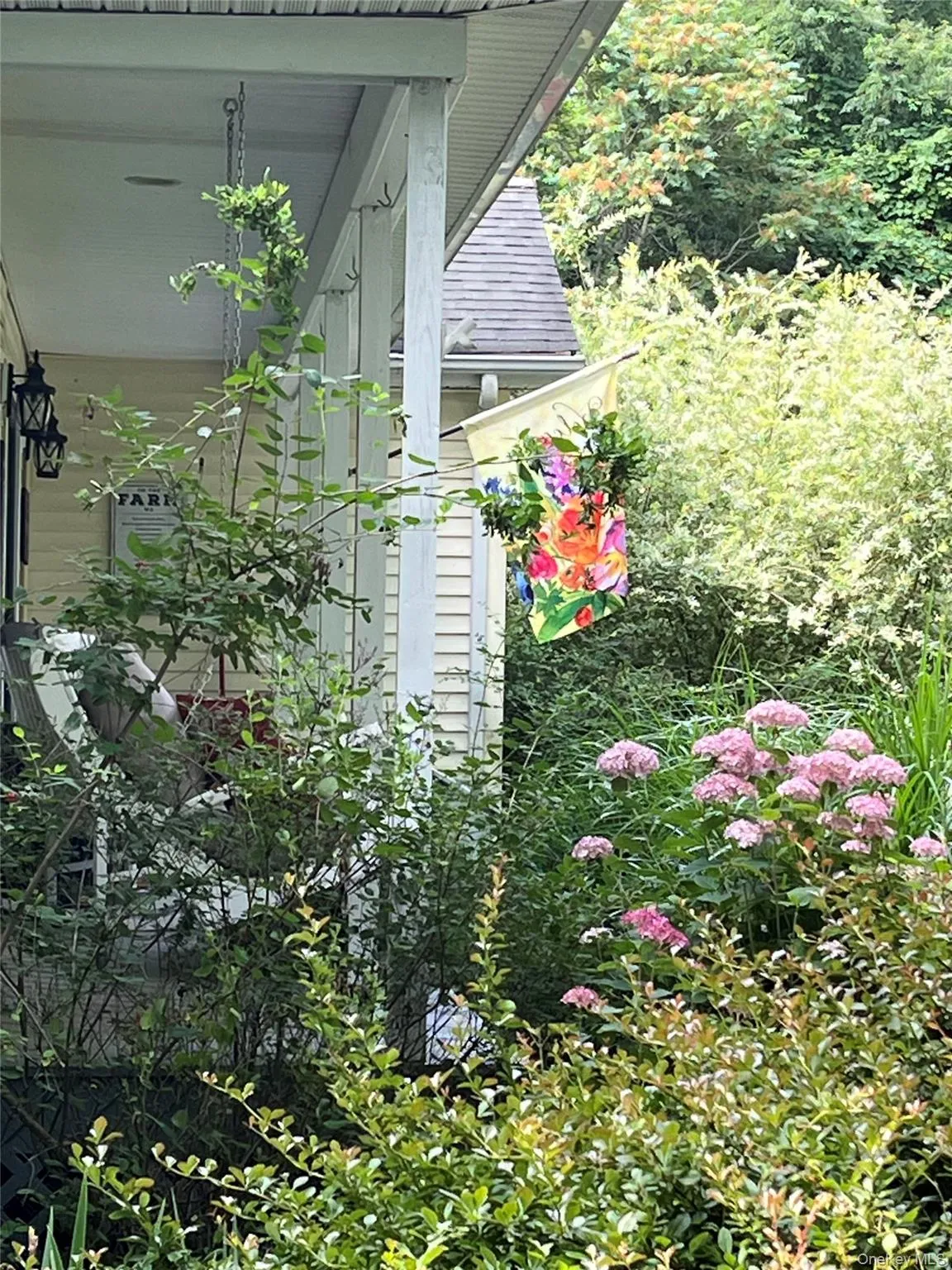 Rocking Chair Front Porch Overlooking Flowering Yard Rocking Chair Front Porch Overlooking Flowering Yard