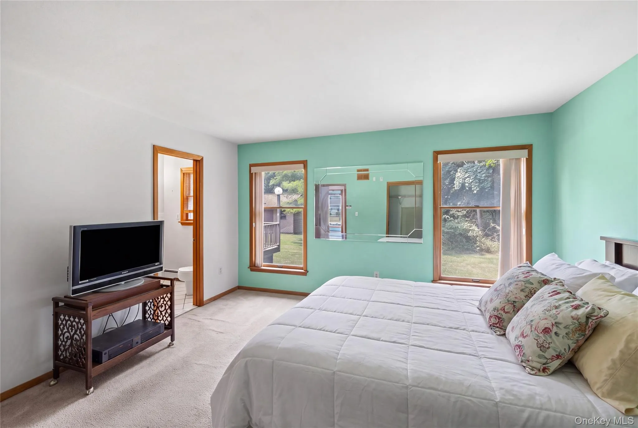 Primary bedroom with bathroom, first floor. Primary bedroom with bathroom, first floor.