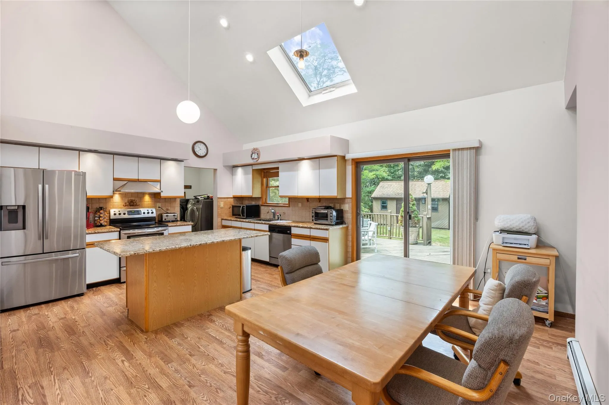 Large eat in kitchen, vaulted ceilings, sliding glass door to deck. Large eat in kitchen, vaulted ceilings, sliding glass door to deck.