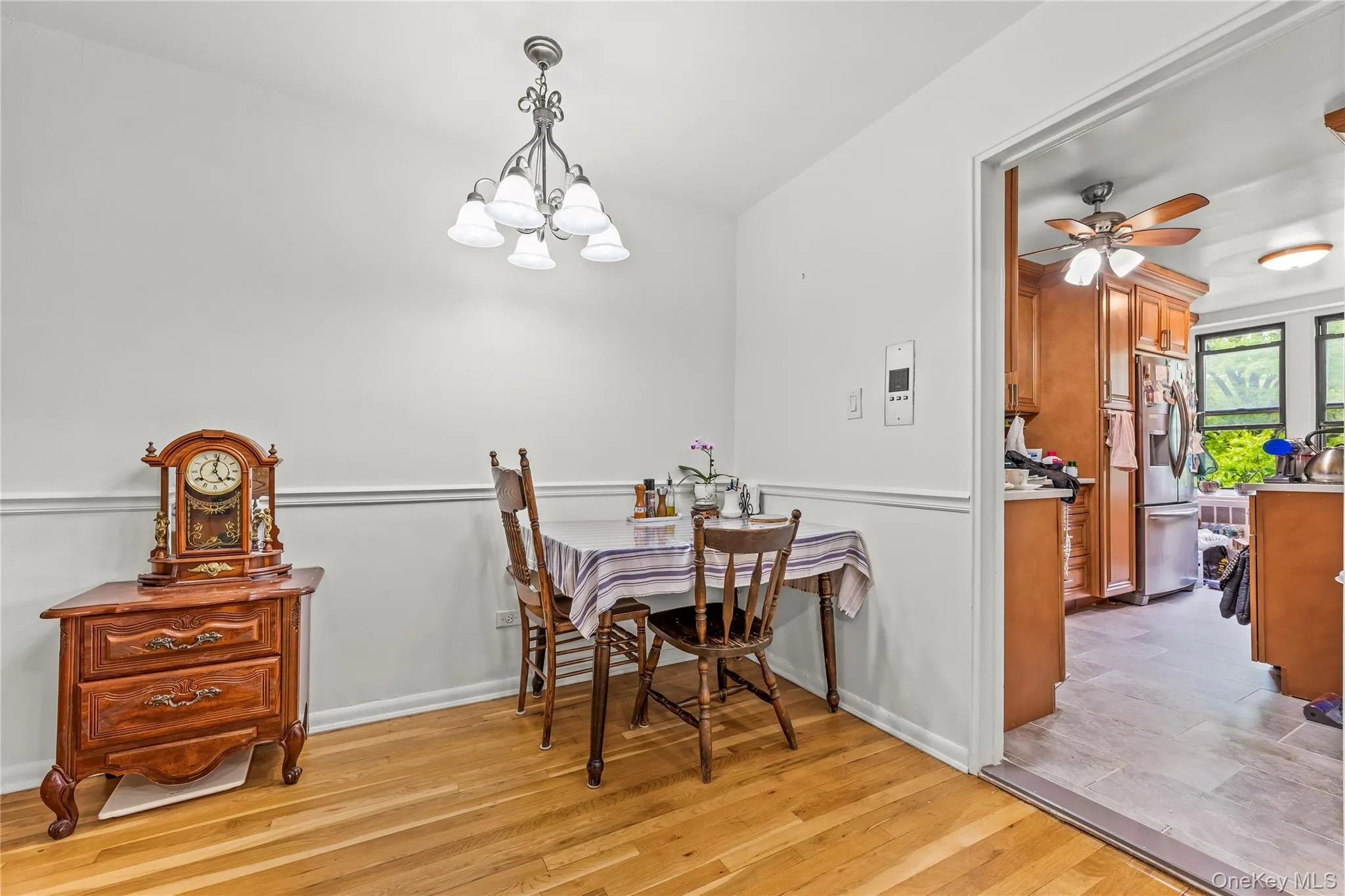 Hardwood-style flooring extends through this room, complemented by a chair rail molding Hardwood-style flooring extends through this room, complemented by a chair rail molding