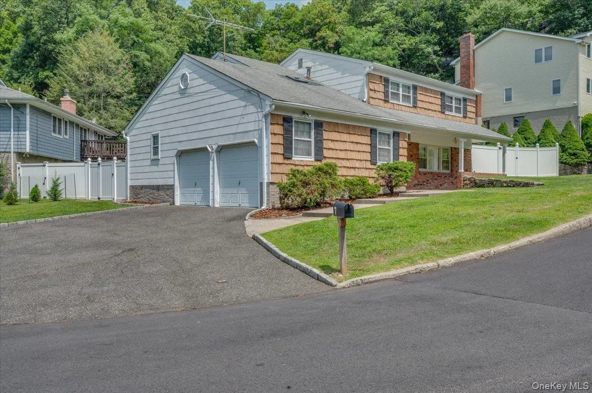 Two Car Garage and Additional Driveway Parking Space Two Car Garage and Additional Driveway Parking Space