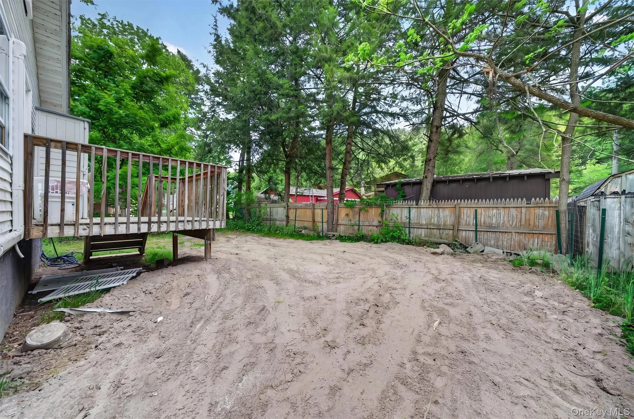 Back yard. Lawn disturbed as new septic just installed. Back yard. Lawn disturbed as new septic just installed.