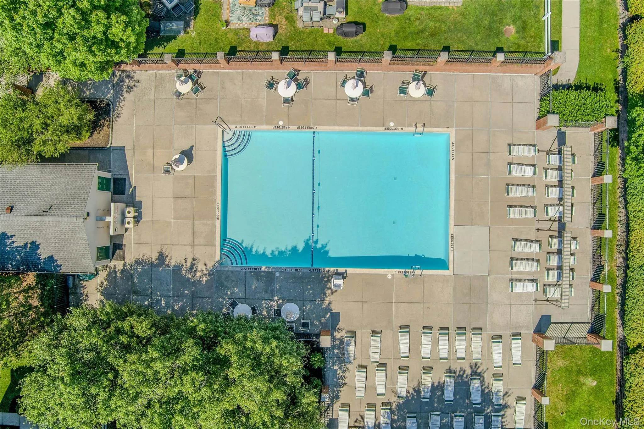 Center of community boasts large swimming pool supervised by lifeguard Center of community boasts large swimming pool supervised by lifeguard