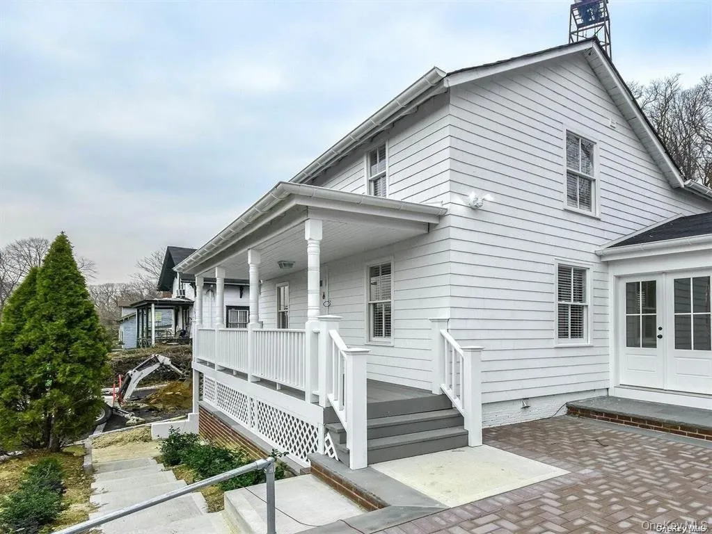 View of property exterior featuring french doors and a patio View of property exterior featuring french doors and a patio