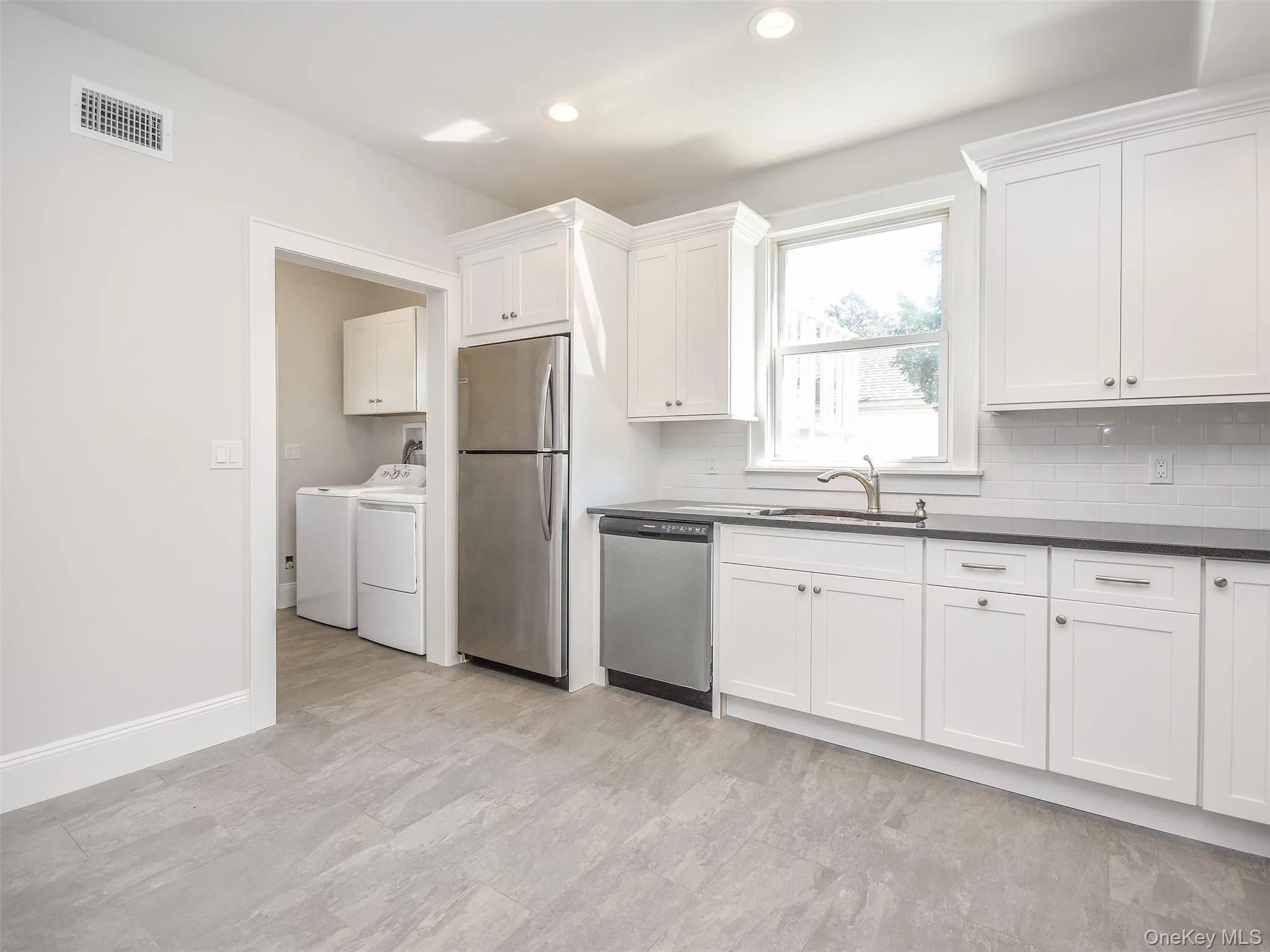 Kitchen open to laundry room Kitchen open to laundry room