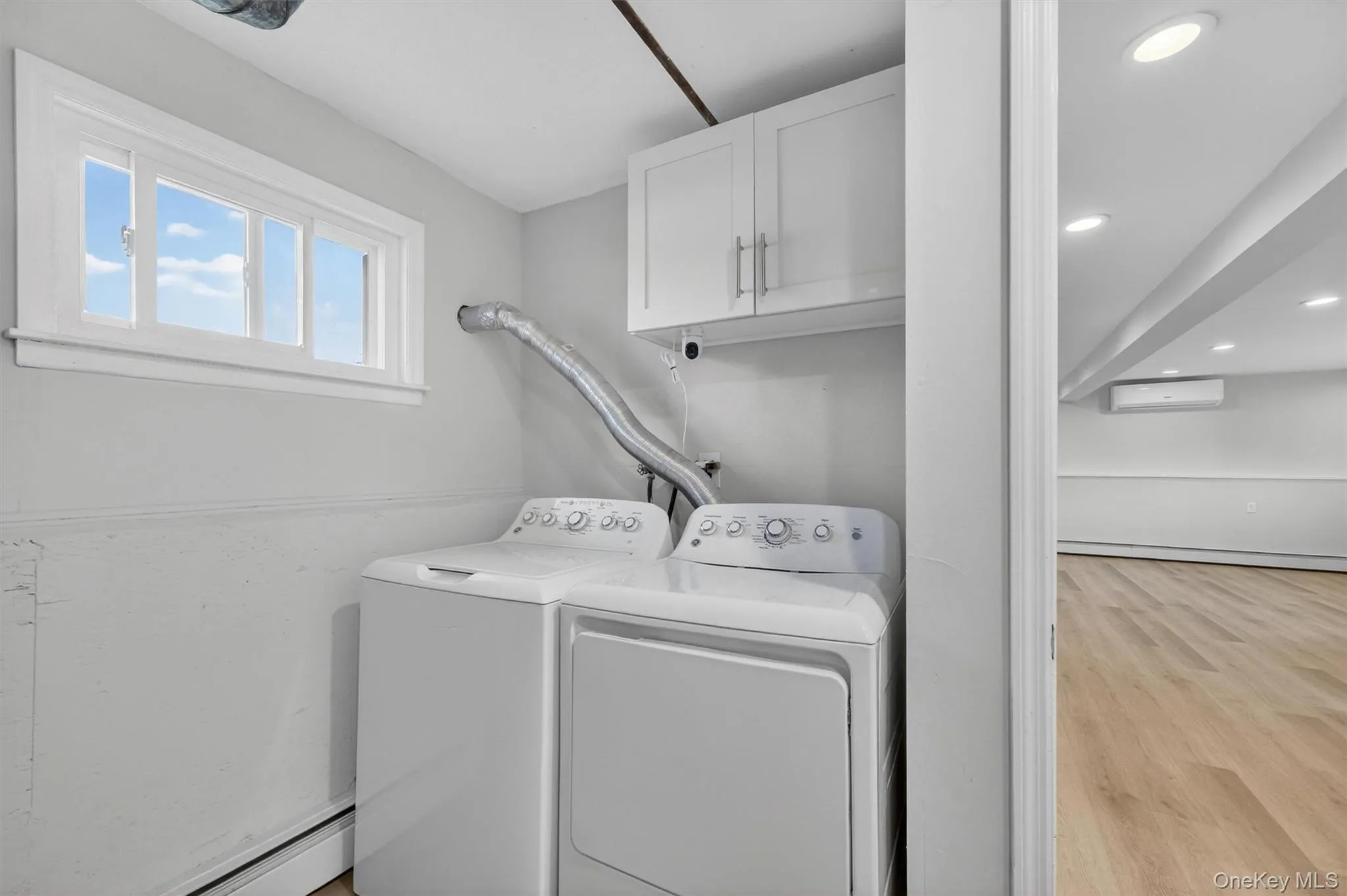 Lower Level Laundry, Utility Room and Garage Access. Lower Level Laundry, Utility Room and Garage Access.