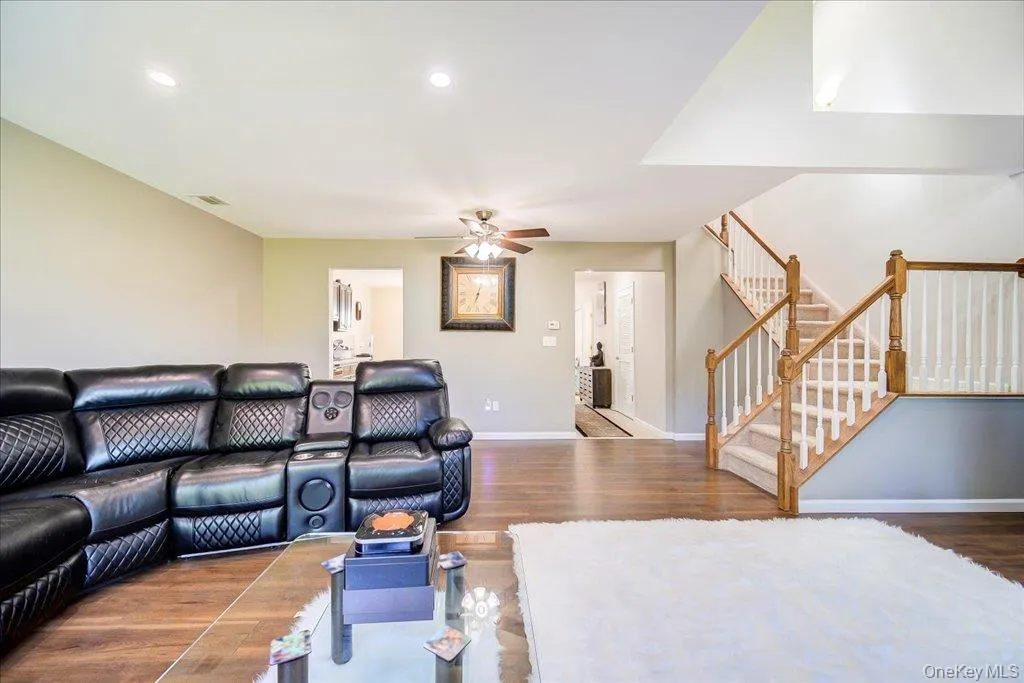 Large 2 story open living room with gas fireplace, large windows, and newer flooring. Large 2 story open living room with gas fireplace, large windows, and newer flooring.