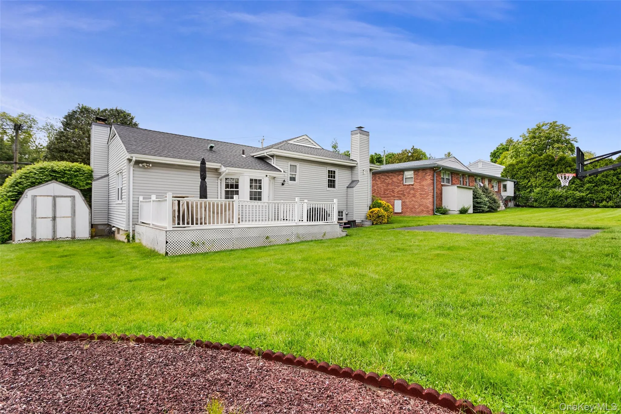 Private backyard with deck and storage shed. Private backyard with deck and storage shed.