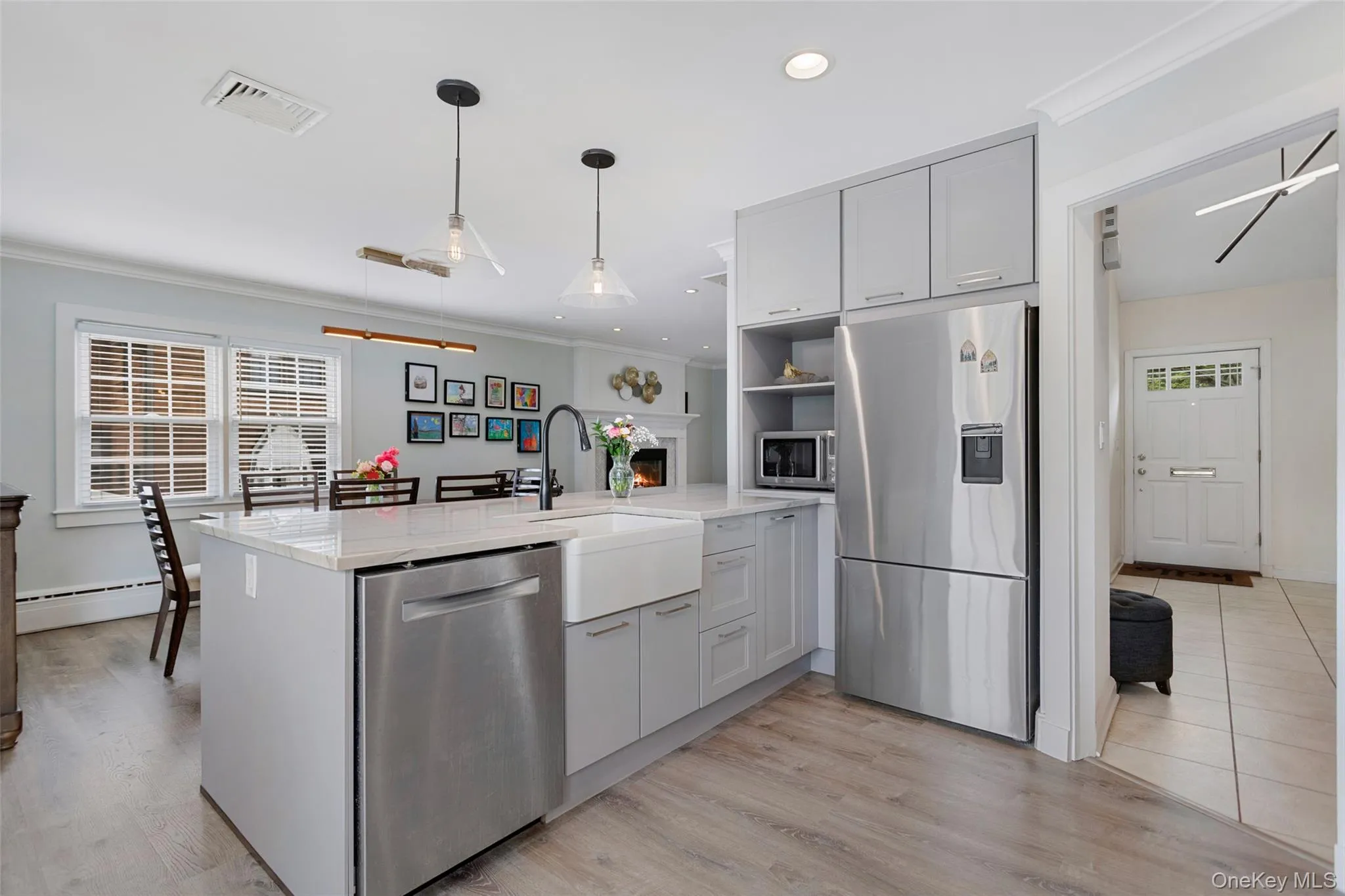 Contemporary kitchen with island and farmhouse sink. Contemporary kitchen with island and farmhouse sink.