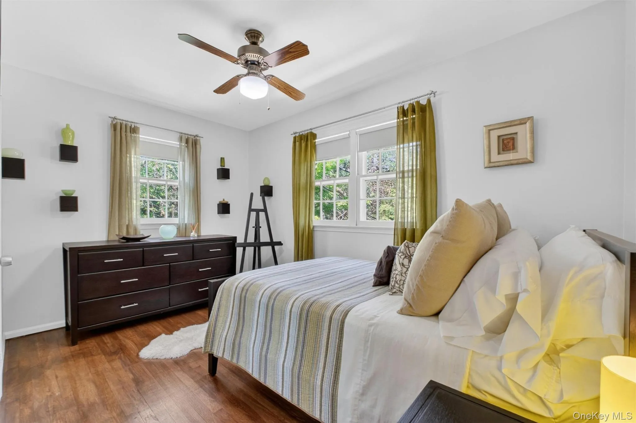 Dream in the ample second bedroom featuring western and northern exposures Dream in the ample second bedroom featuring western and northern exposures