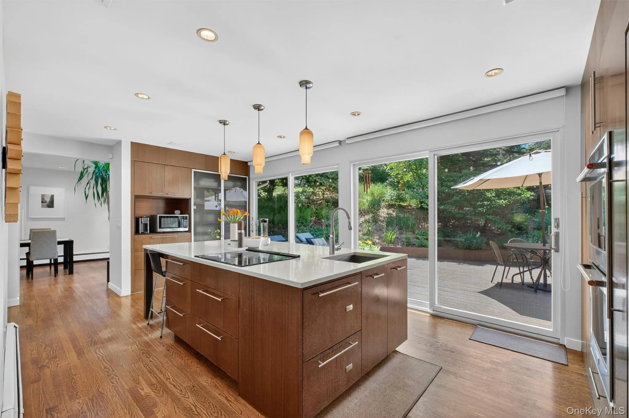 Create in the sun-filled eat-in chef’s kitchen boasting a large island, custom cabinetry, integrated appliances and more Create in the sun-filled eat-in chef’s kitchen boasting a large island, custom cabinetry, integrated appliances and more