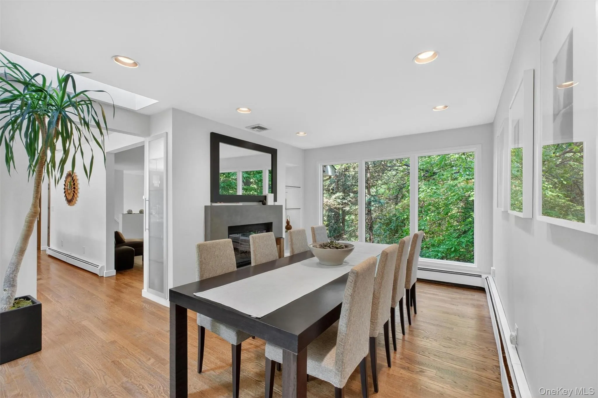 Entertain lavishly or casually in the large dining room with walls of windows and a double-sided fireplace Entertain lavishly or casually in the large dining room with walls of windows and a double-sided fireplace