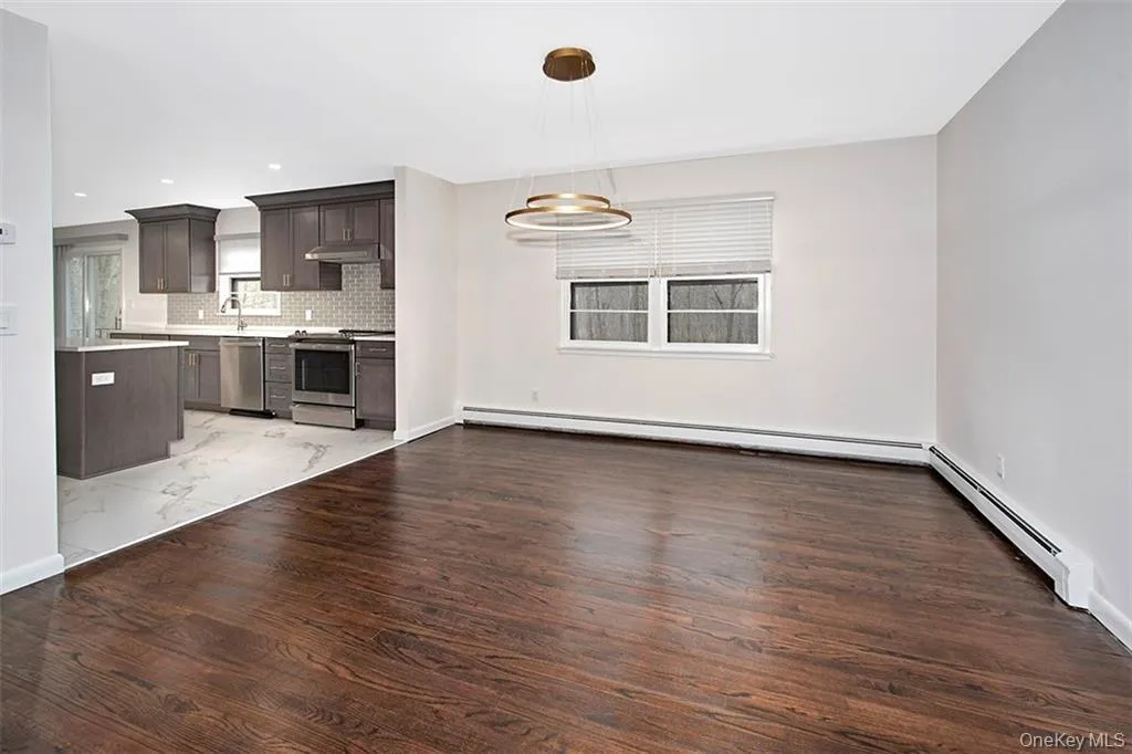 Dining Room open to Living Room and wide opening to Kitchen Dining Room open to Living Room and wide opening to Kitchen
