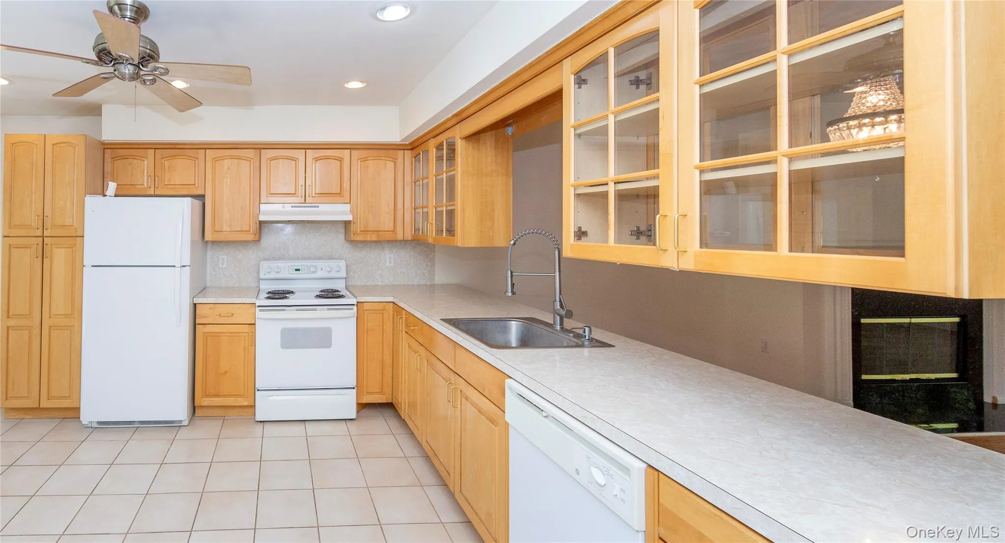 On the other side of the dining area is the large country kitchen. On the other side of the dining area is the large country kitchen.