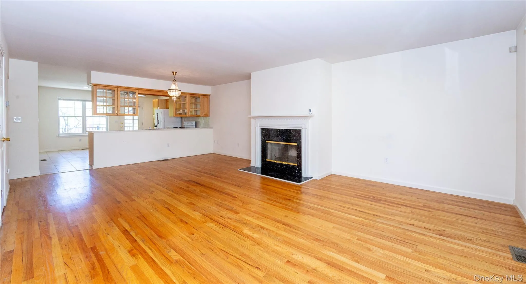 Step inside to find hardwood flooring and a sun-drenched open floor plan. Step inside to find hardwood flooring and a sun-drenched open floor plan.