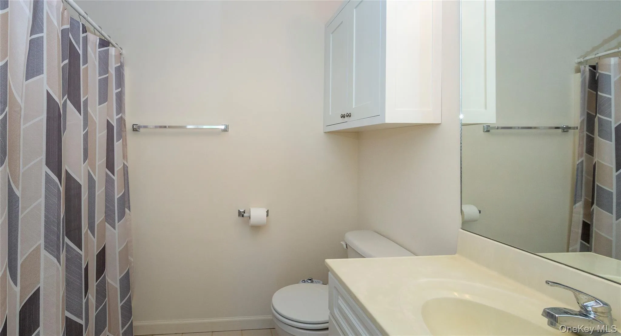 A full bath with a tub and linen closet serves the upper level. A full bath with a tub and linen closet serves the upper level.