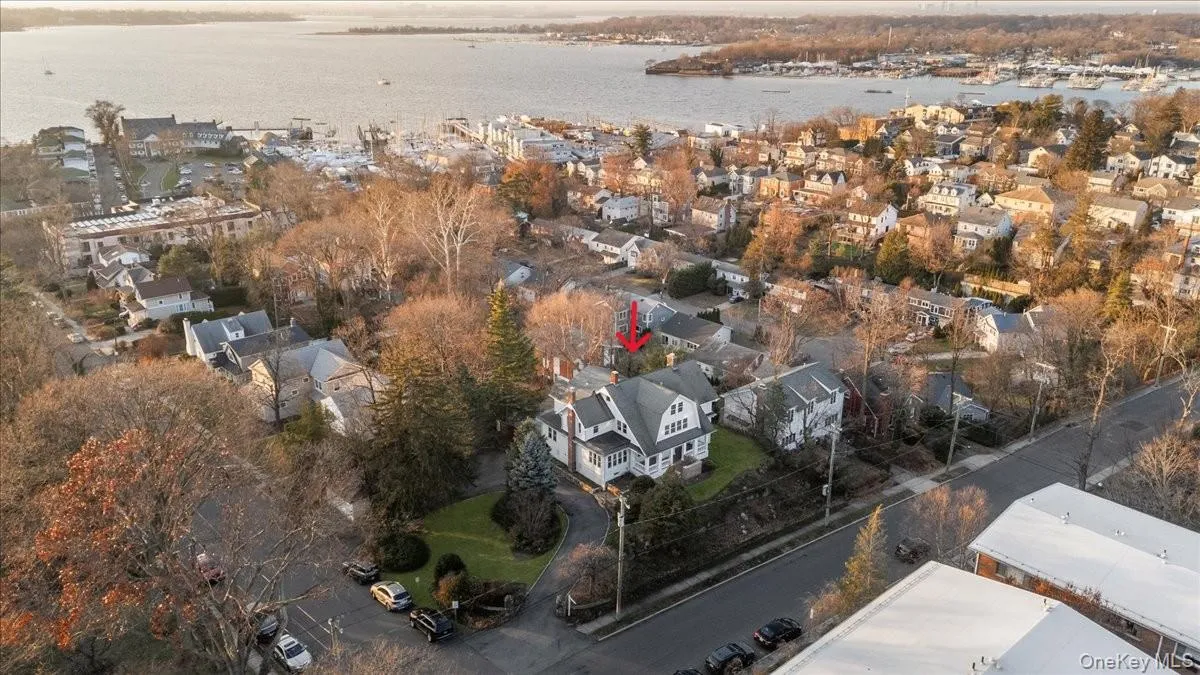 Aerial view of residential area with a large body of water Aerial view of residential area with a large body of water