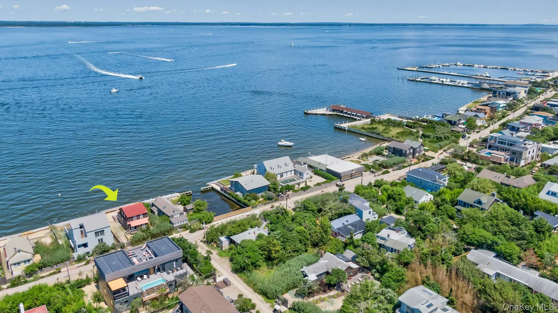 Waterfront property featuring direct access, a private dock, and a sandy shoreline Waterfront property featuring direct access, a private dock, and a sandy shoreline