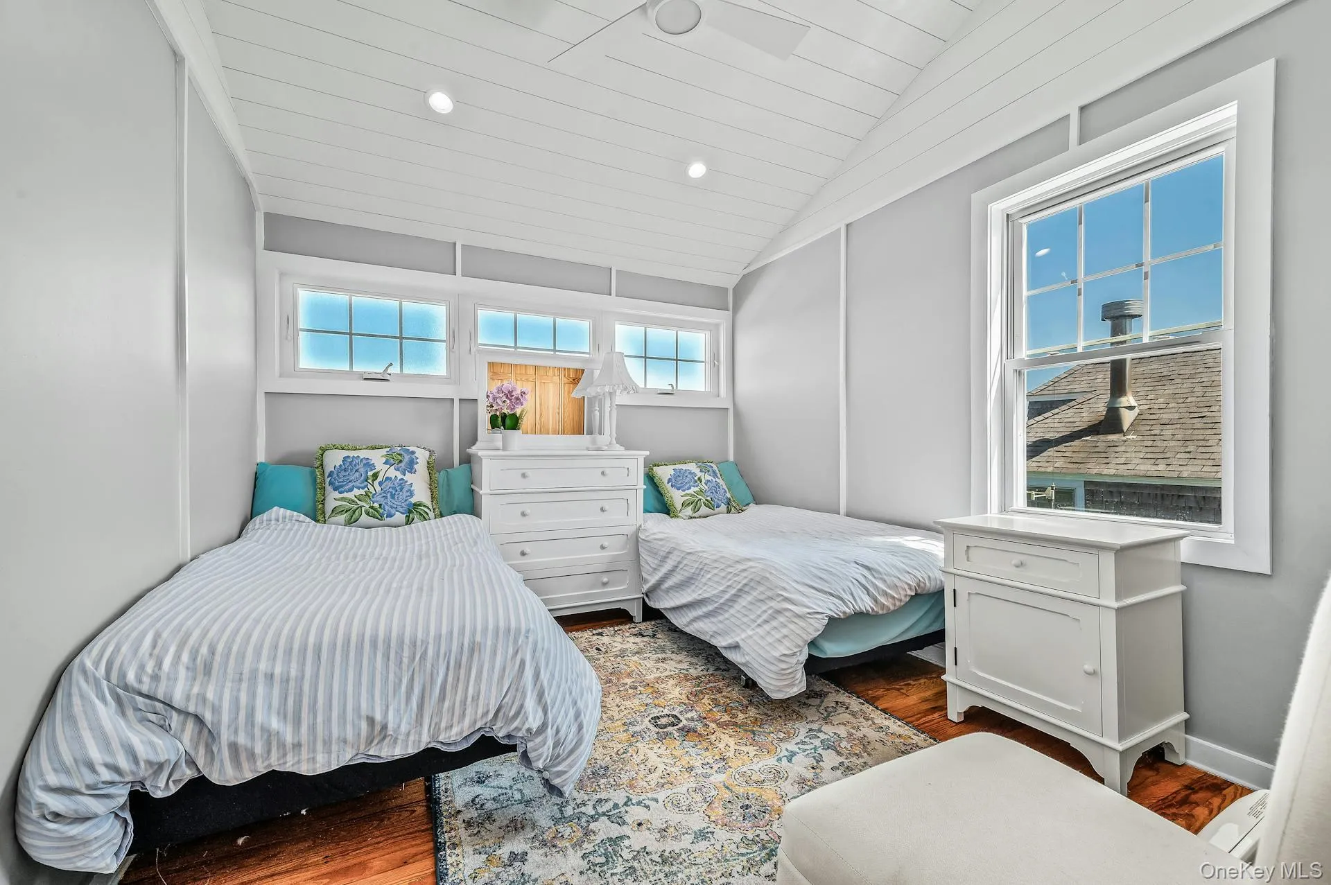Vaulted wood-plank ceiling with recessed lighting and ceiling fan Vaulted wood-plank ceiling with recessed lighting and ceiling fan