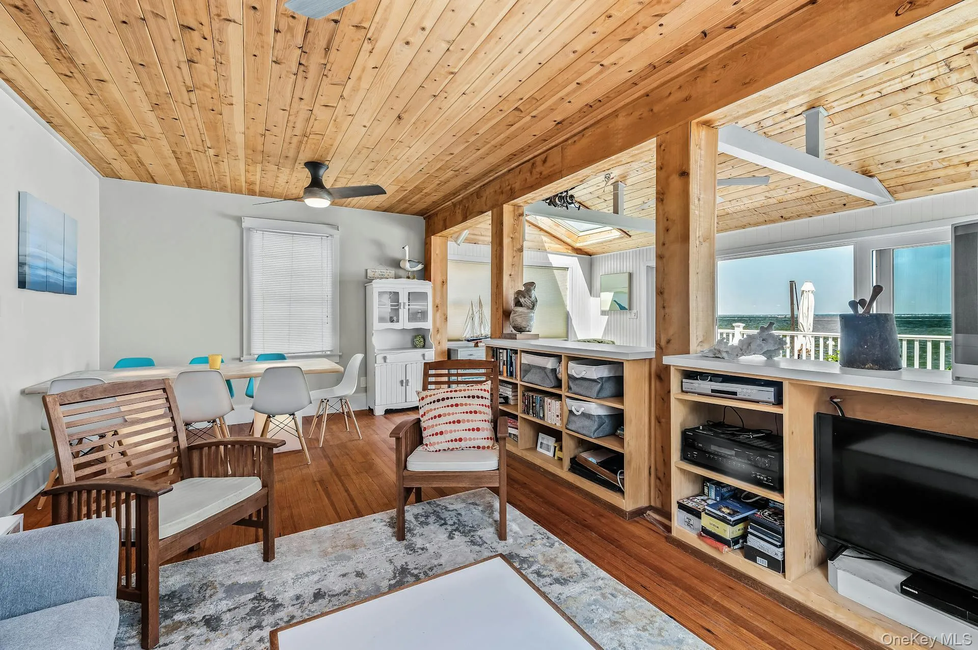 Interior featuring wood-finish ceiling, hardwood flooring, built-in shelving. Interior featuring wood-finish ceiling, hardwood flooring, built-in shelving.