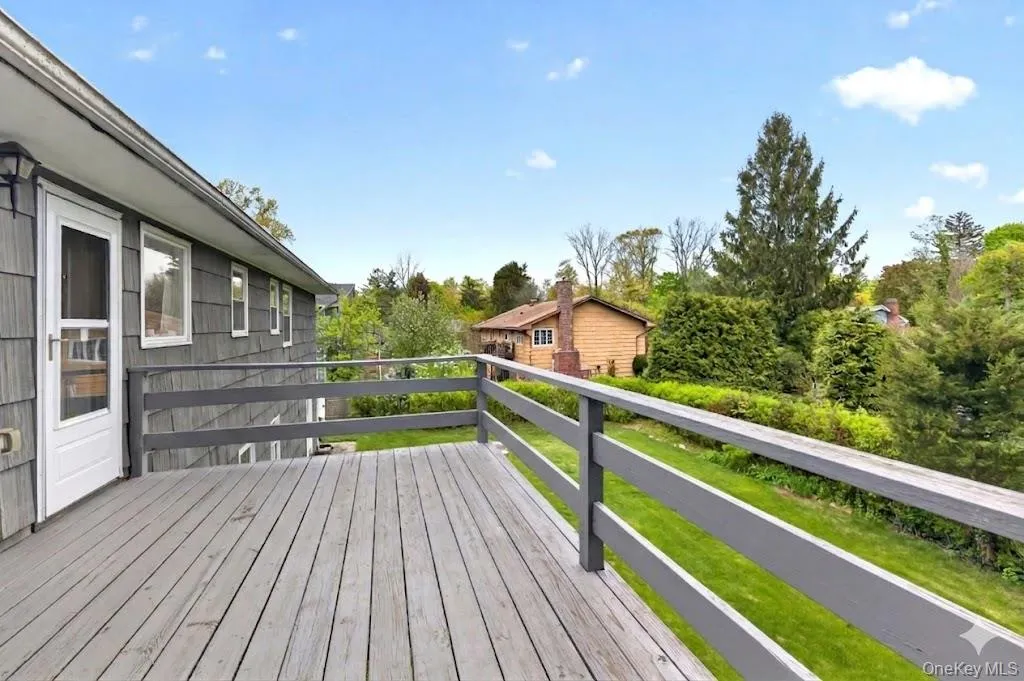Expansive wood deck with painted railings Expansive wood deck with painted railings