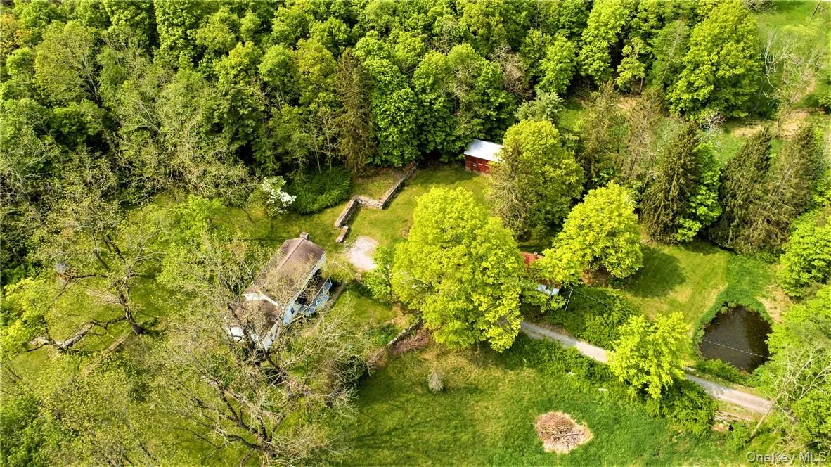 Looking down on the house cottage and pond Looking down on the house cottage and pond
