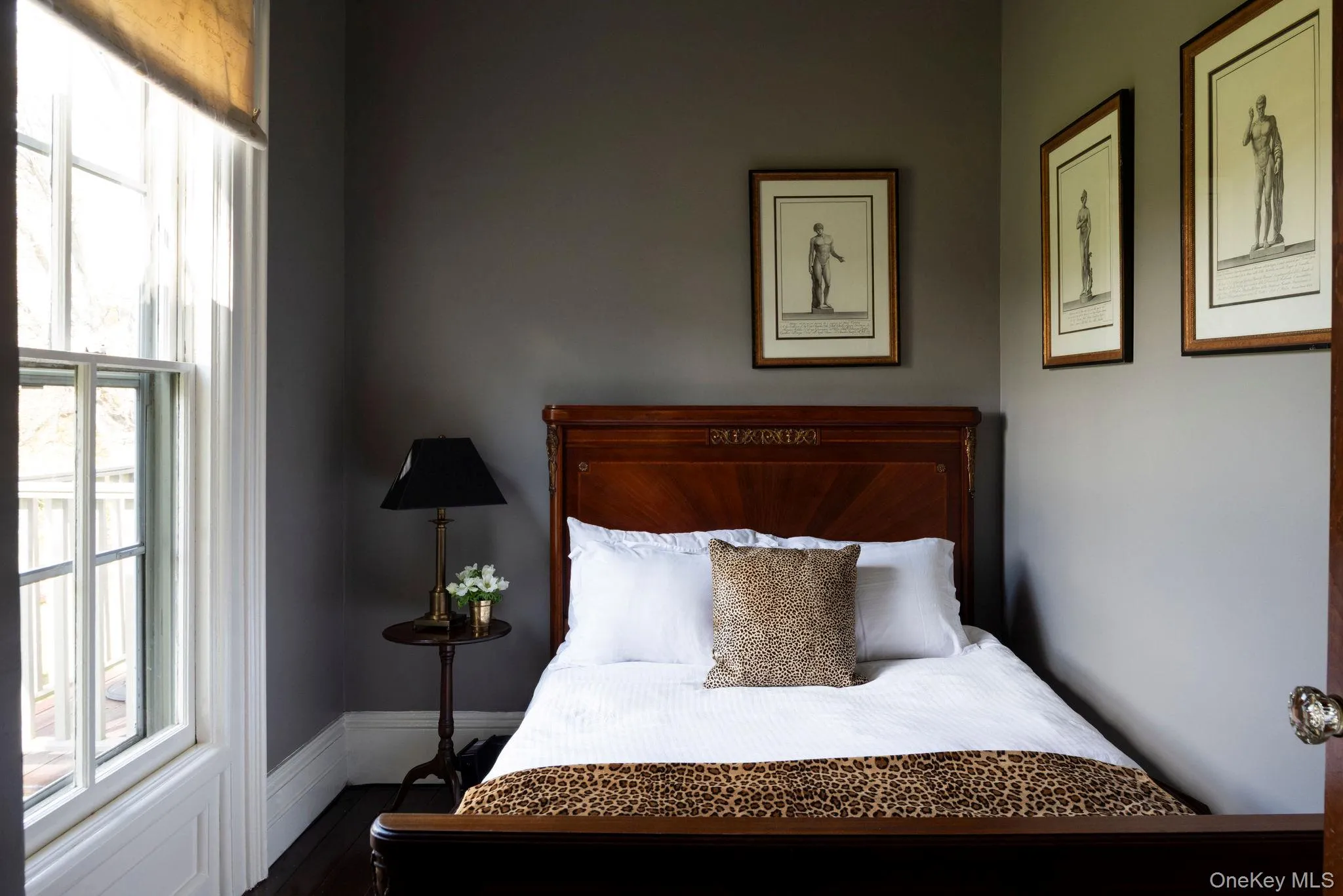 Bedroom featuring dark wood-style floors Bedroom featuring dark wood-style floors