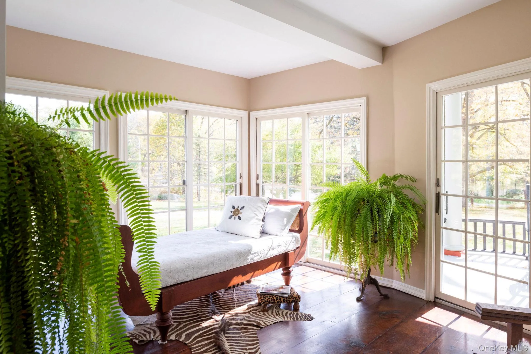Sitting room featuring healthy amount of natural light and beam ceiling Sitting room featuring healthy amount of natural light and beam ceiling