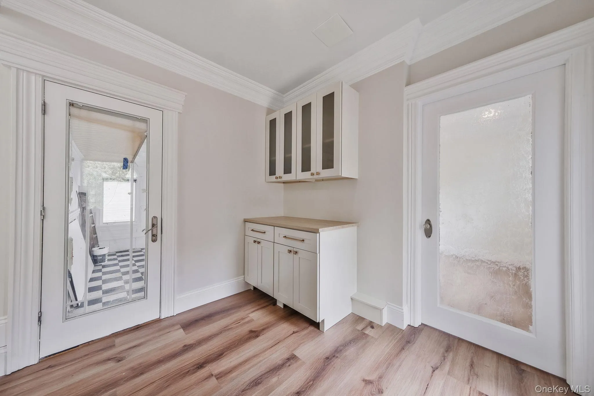 Garage entrance into pantry with exit to backyard Garage entrance into pantry with exit to backyard