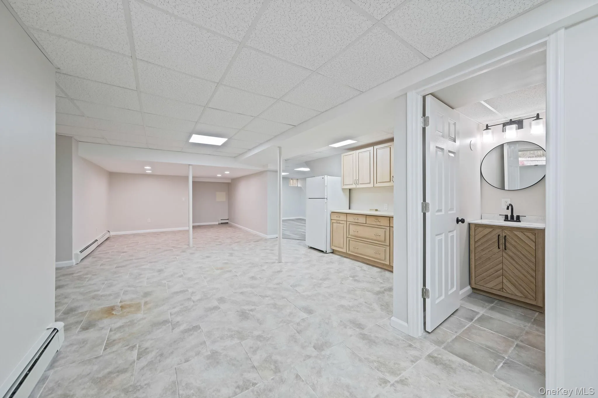 Finished basement with wet bar, full bathroom with convenient outdoor access to backyard and pool area Finished basement with wet bar, full bathroom with convenient outdoor access to backyard and pool area