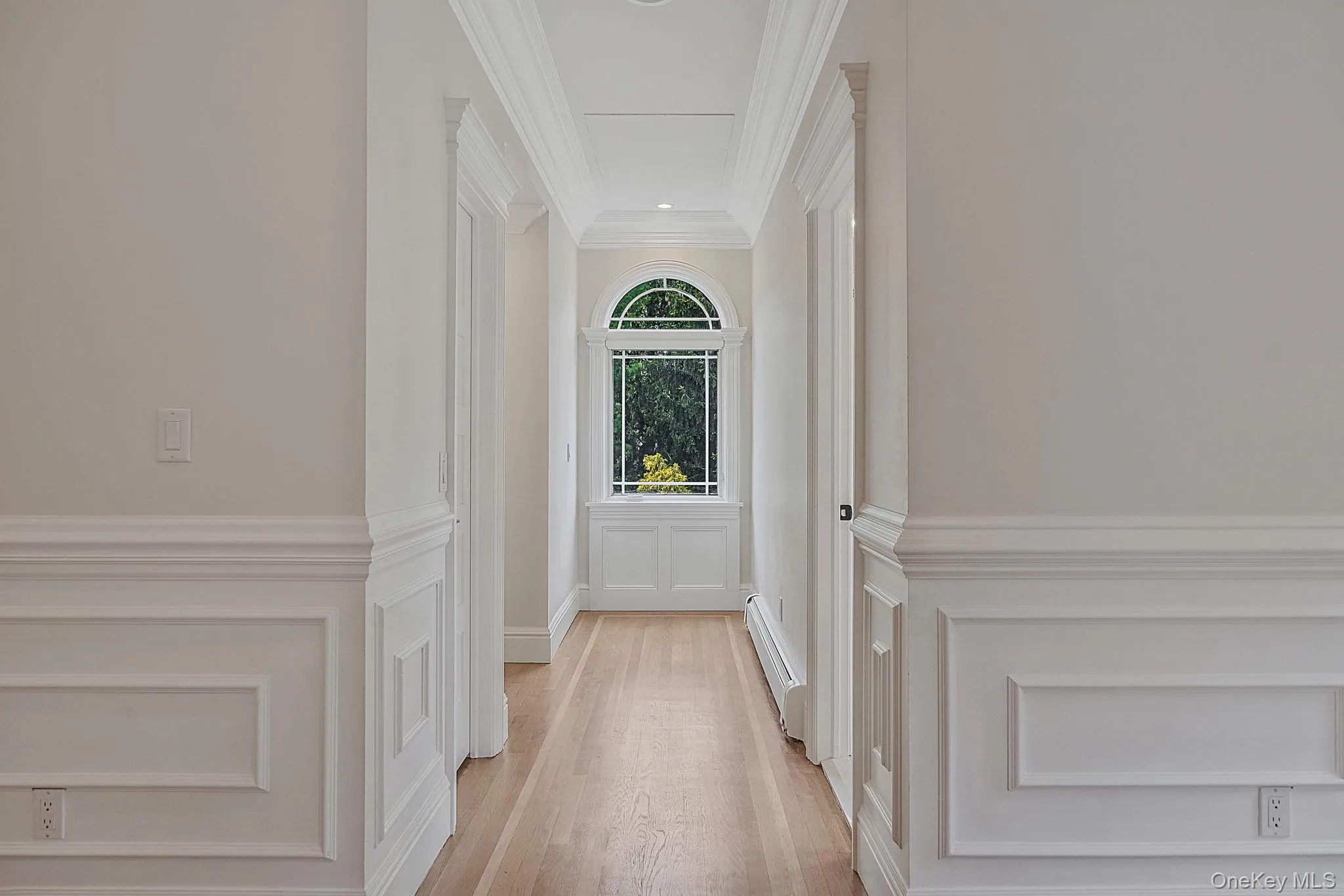 Primary bedroom hallway with entrances to bathroom and walk in closet Primary bedroom hallway with entrances to bathroom and walk in closet