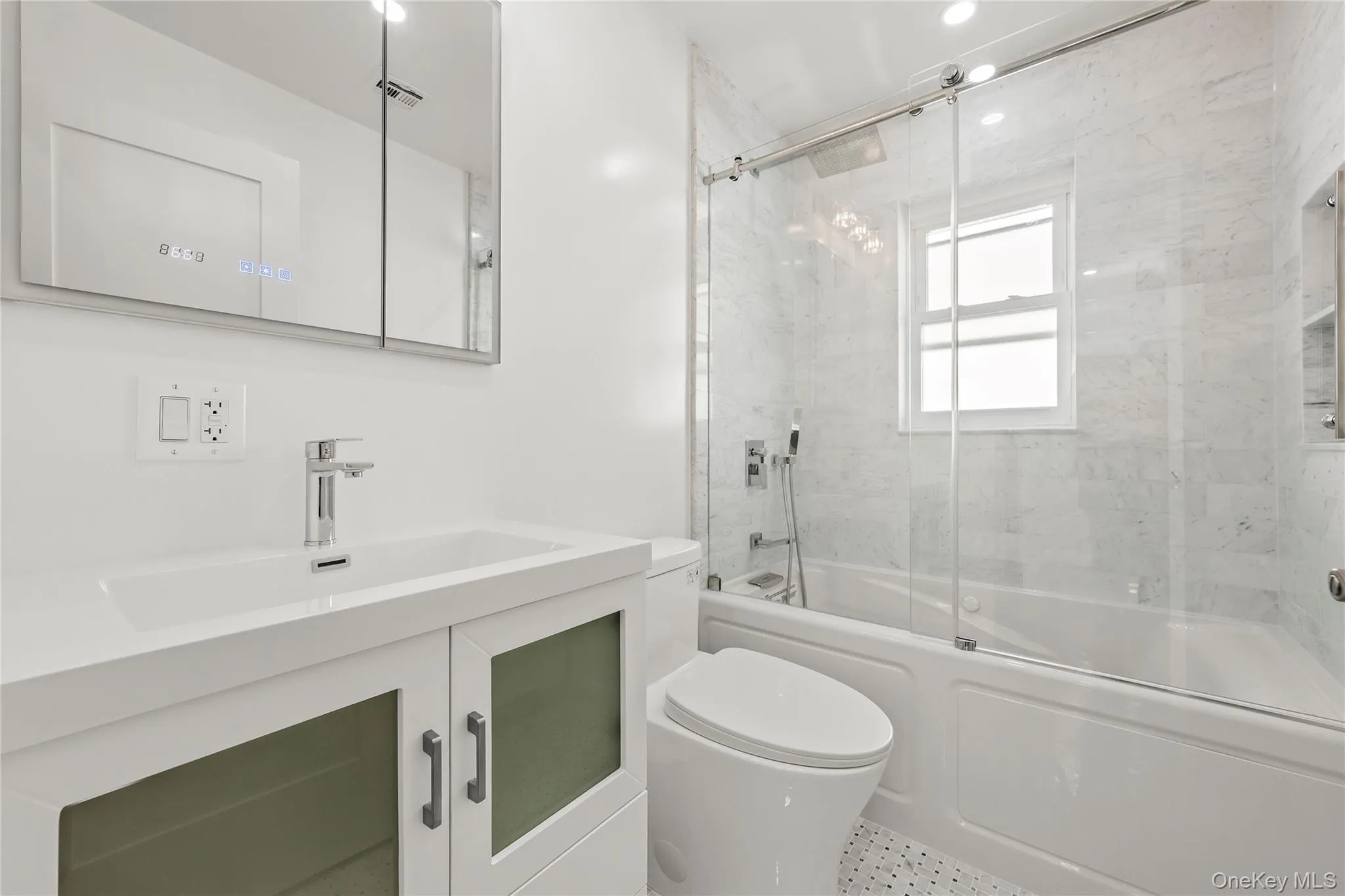 Full bathroom featuring a white vanity with integrated sink, chrome faucet, and a wall-mounted medicine cabinet Full bathroom featuring a white vanity with integrated sink, chrome faucet, and a wall-mounted medicine cabinet