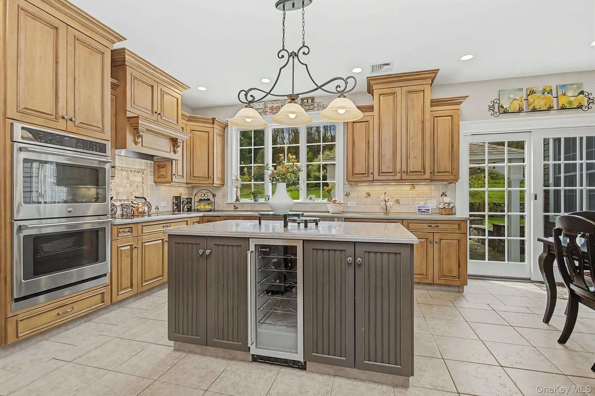Custom cabinets with pantry, double oven, island with wine fridge... Custom cabinets with pantry, double oven, island with wine fridge...