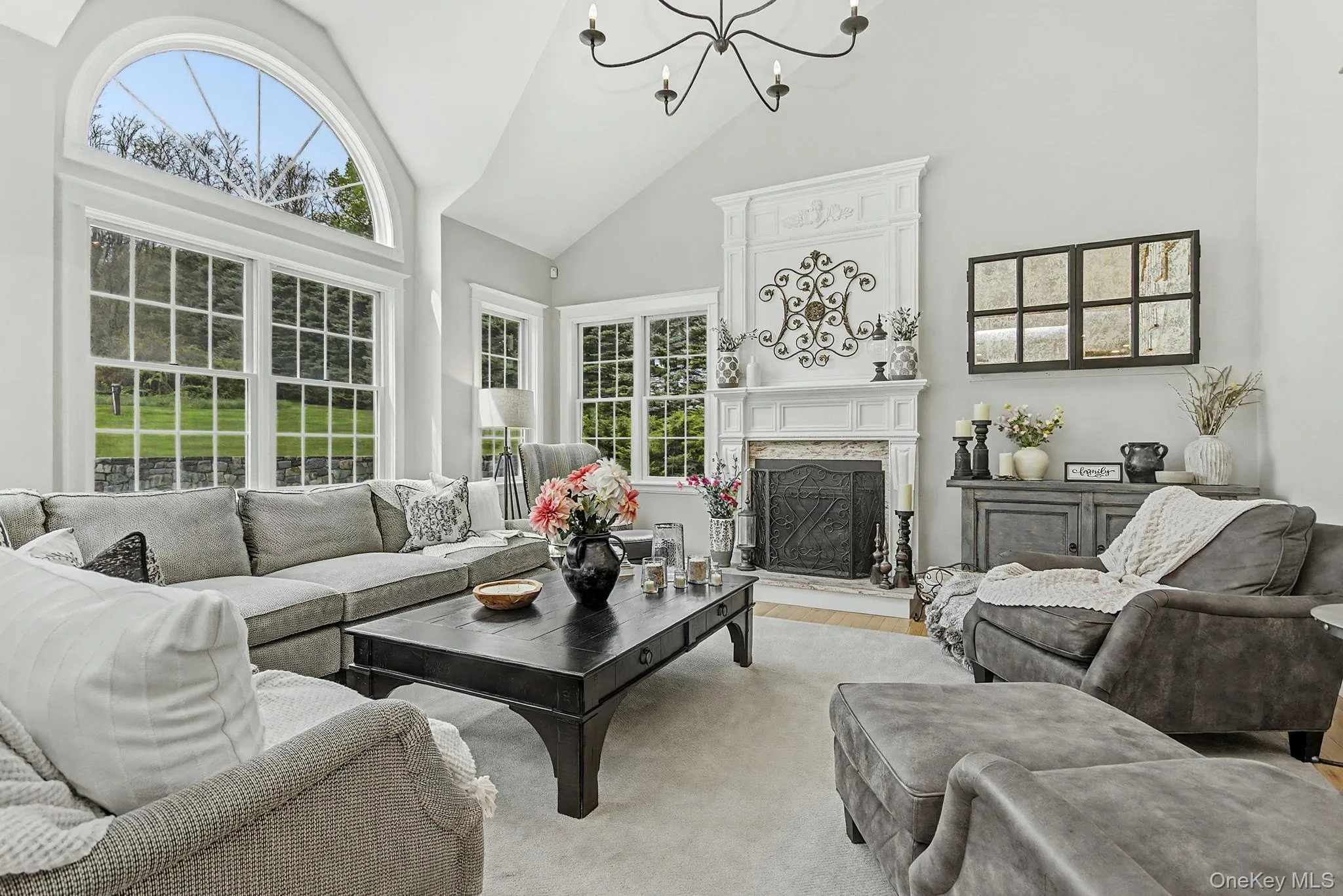 ...Vaulted ceilings, arched sunburst transom window, gas FP with custom mantel and honed granite ...Vaulted ceilings, arched sunburst transom window, gas FP with custom mantel and honed granite