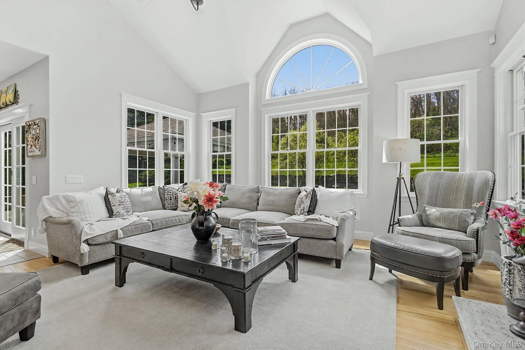 ...Dramatic two-story wall of windows that fills the space with natural light, and hwf... ...Dramatic two-story wall of windows that fills the space with natural light, and hwf...