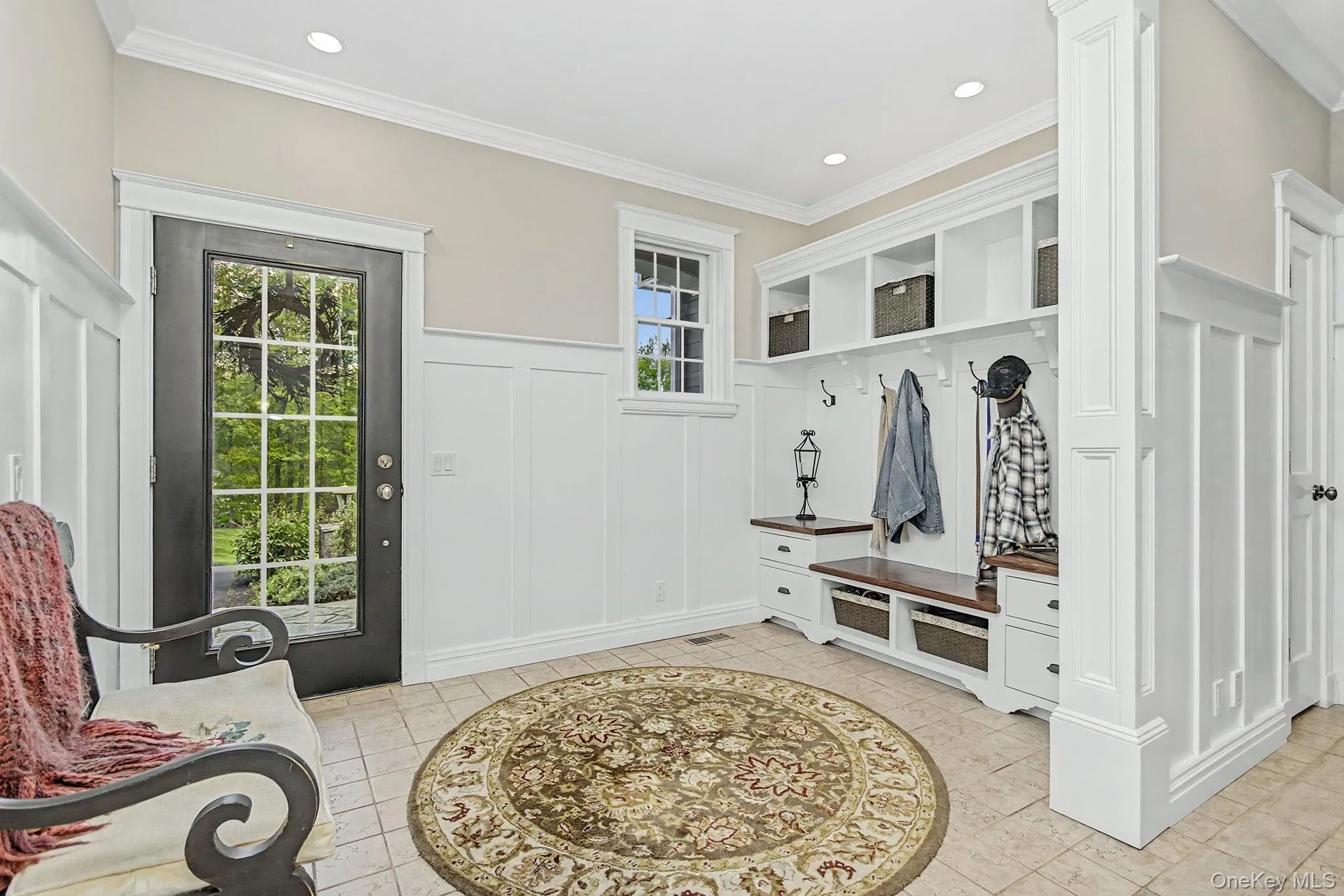 Custom cubbies, with a bench and wood panel walls. Custom cubbies, with a bench and wood panel walls.