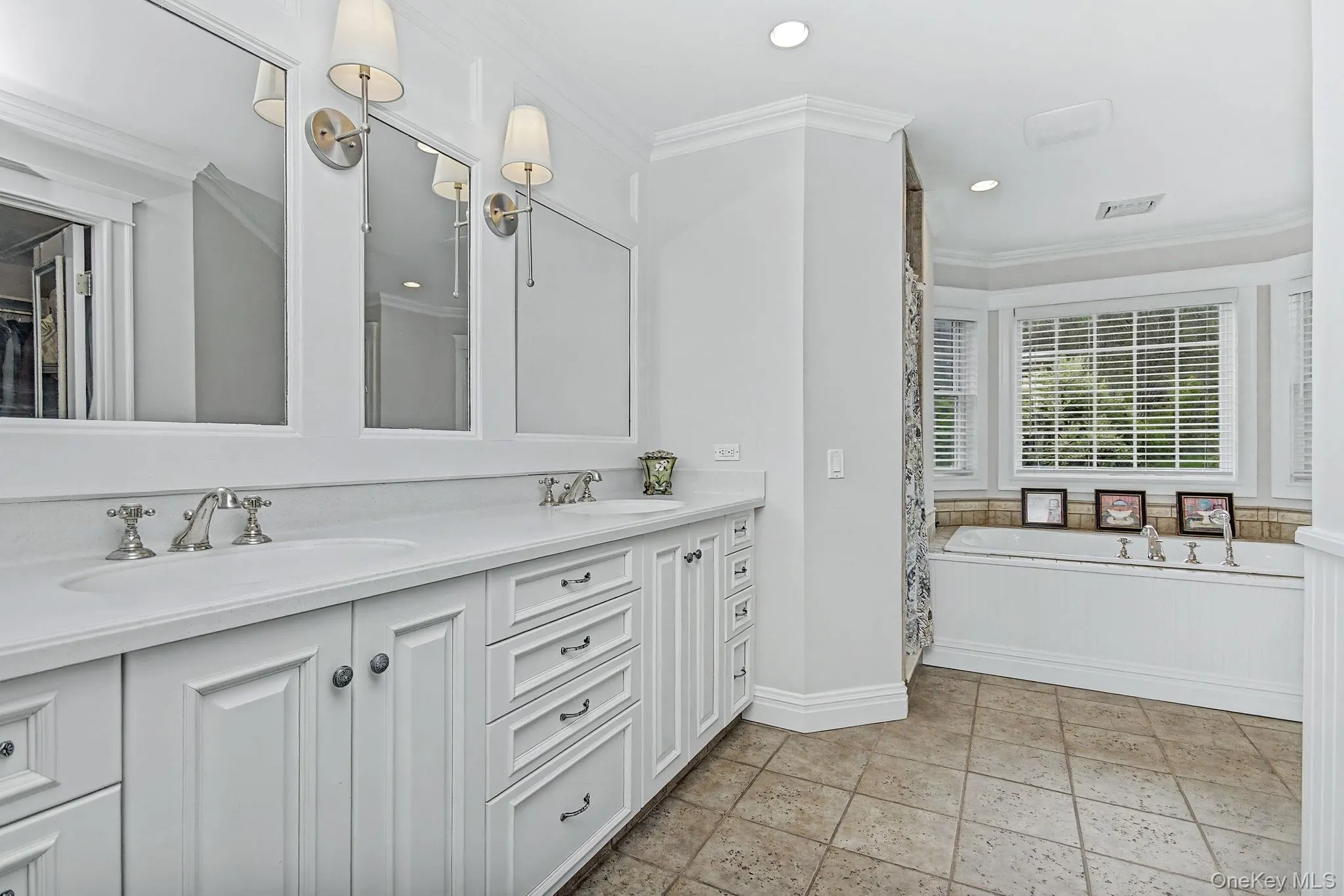 Double sinks, soaking tub, water closet & tiled shower Double sinks, soaking tub, water closet & tiled shower