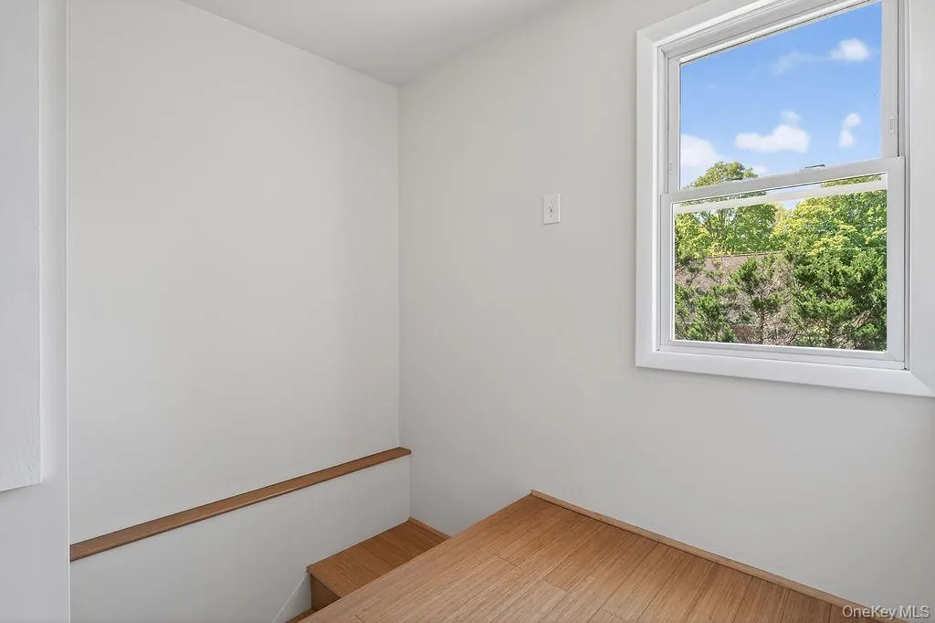 The upper-level hallway is bright and airy. The upper-level hallway is bright and airy.