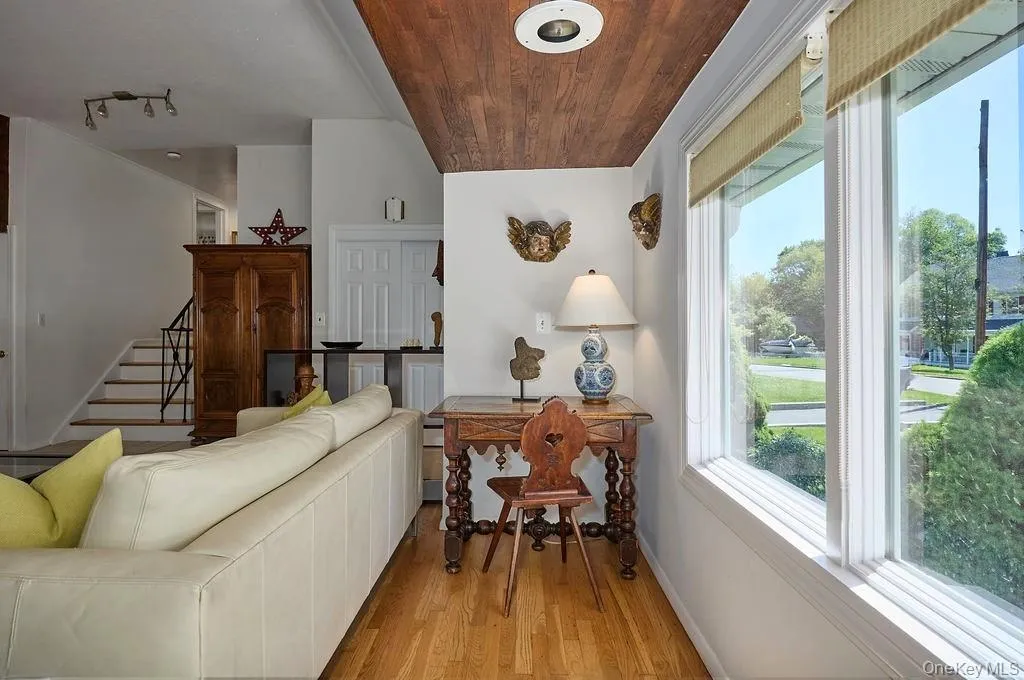 Sunlit interior featuring wood-paneled ceiling accent Sunlit interior featuring wood-paneled ceiling accent